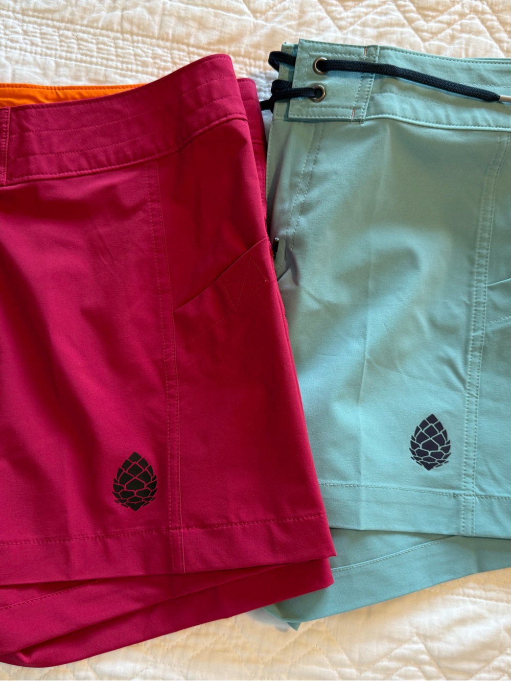 NWOT. 2 prs Stio Women's board Shorts in Fuchsia and Aqua; brand new; never worn